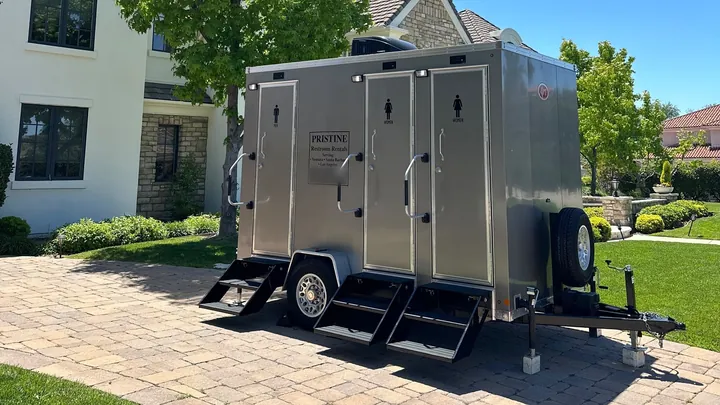 The 3-Stall Restroom Trailer set up in a driveway